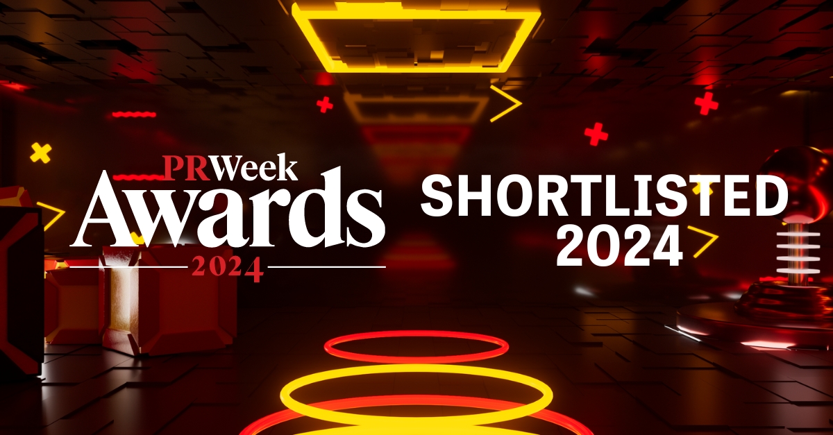 Abstract red and yellow lights as a background with PR Week Awards 2024 logo overlaid in white